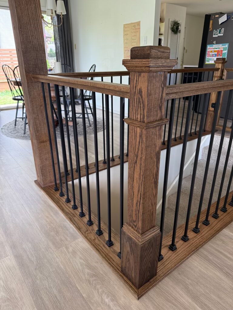 Handcrafted wooden guardrails on staircase showcasing clean lines and quality finish