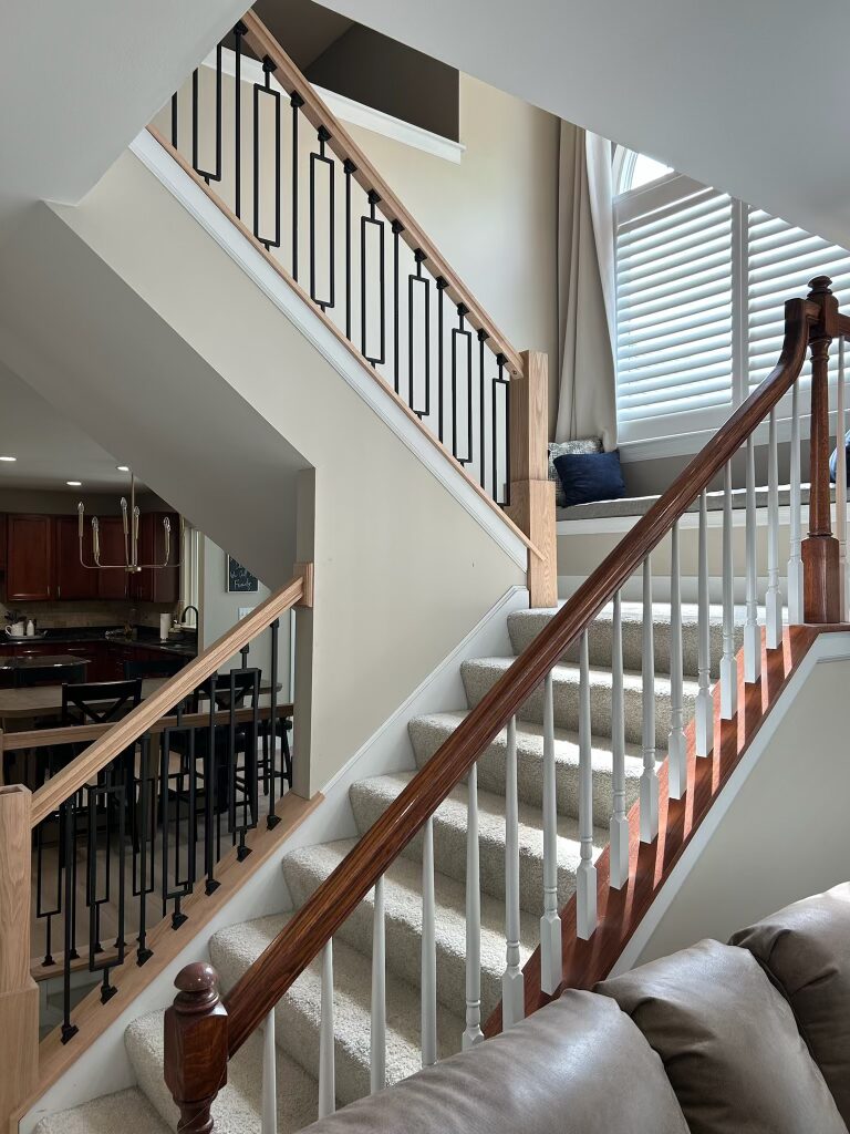 Custom hardwood staircase with detailed craftsmanship by Struttin Construction
